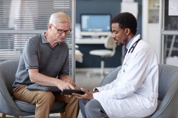 istock White Haired Senior Man Asking Questions in Consultation with Doctor 2190554529