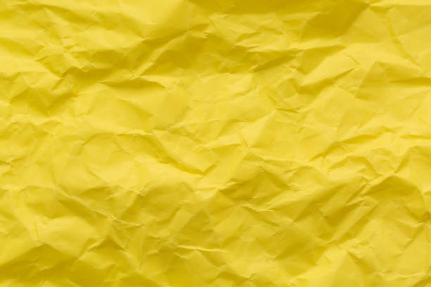 istock Macro crumpled yellow paper texture,Yellow textured paper background 2190554541