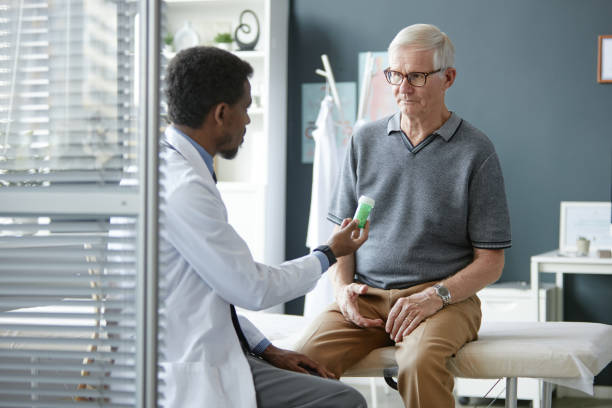 istock Doctor Holding Prescription Bottle Discussing Medication Treatment 2190554584