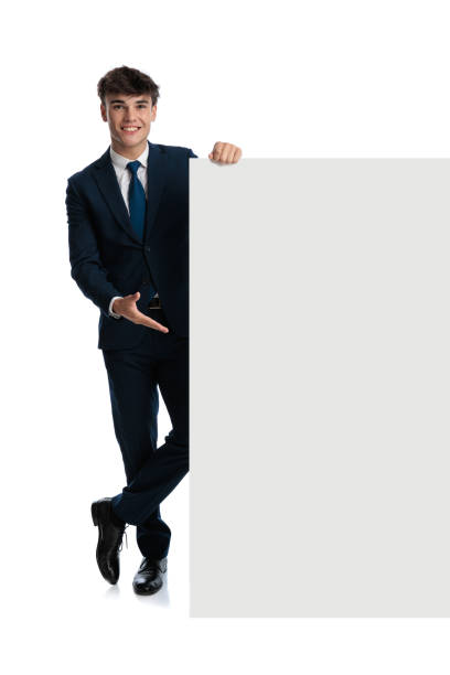 istock proud young businessman presenting white board and smiling 2190555265