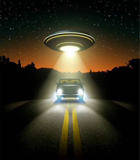 istock UFO Encounter with Pickup Truck at Night on Desert Road, Dramatic Lighting, Vector Illustration 2190555779
