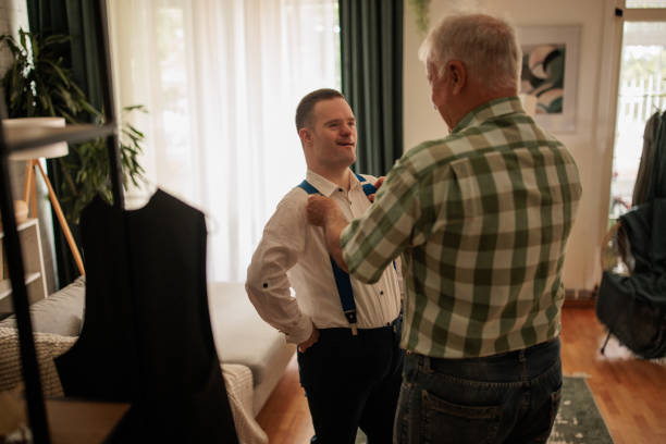 istock Father Helping Son Prepare for Prom 2190556689