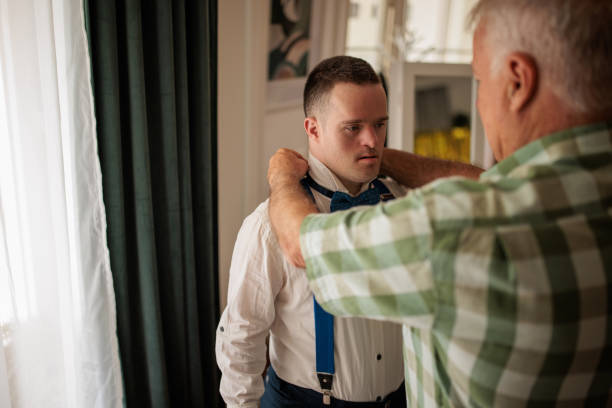 istock Father and Son with Down Syndrome Share a Special Moment 2190556870