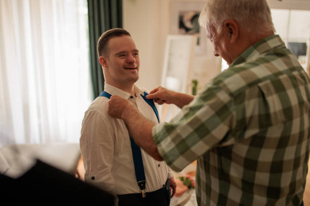istock Father and Son with Down Syndrome Share a Special Moment 2190556957