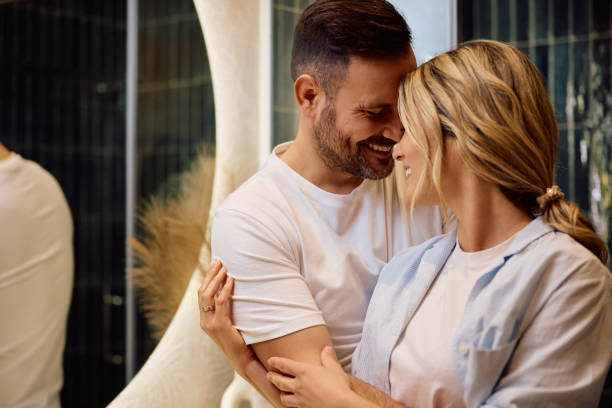 istock Embraced couple in bathroom in the morning. 2190557101