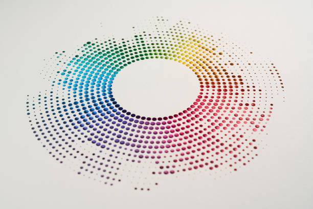 istock Close-up of circular cut paper artwork with vibrant multicolor gradient dots creating abstract geometric design 2190557688