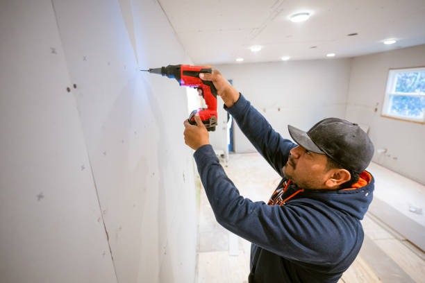 istock Drywall installers working in kitchen renovation 2190558969