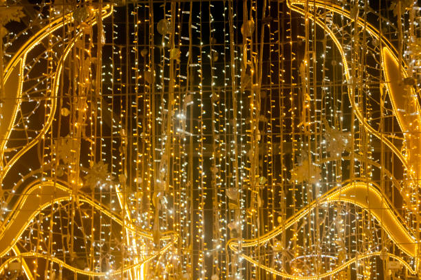 Full frame close-up view of  city street decorations. Rows of LED gold colored light spots. Illumination. Vigo, Pontevedra province, Galicia, Spain.