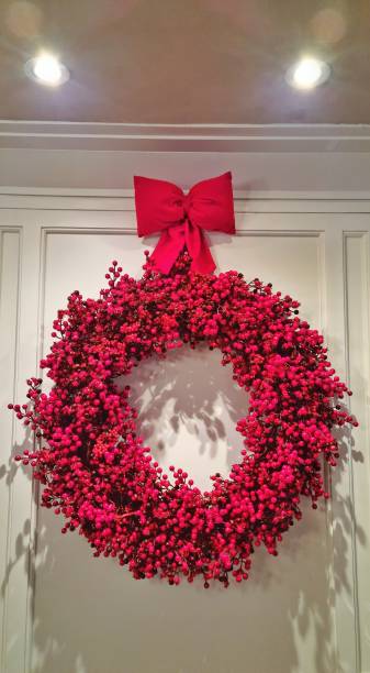 istock Christmas wreath on white door 2190562047