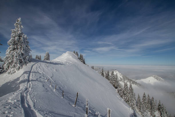 Winter in the bavarian Alps at lake Tegernsee. The Lake Tegernsee is a touritisc place about 50 kilometers away from Munich. In summer and winter there is a lot of tourism. The mountains invite in  wintersport.
