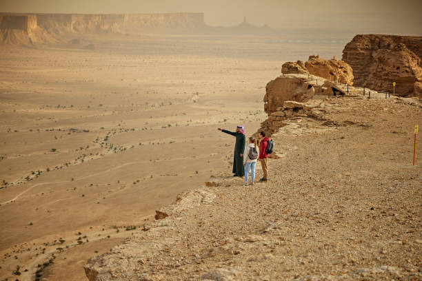 istock Exploring Edge of the World with tourists and Saudi guide 2190563445