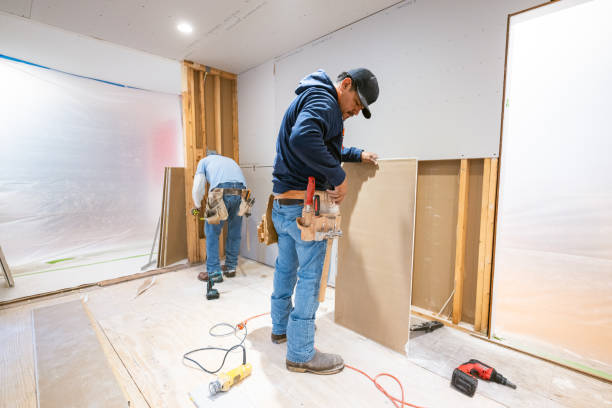 istock Drywall installers working in kitchen renovation 2190564173