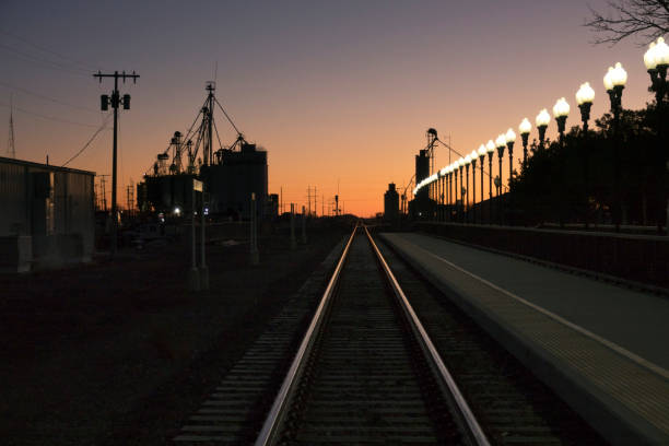 istock Sunrise over railroad tracks grain elevators Lamar Colorado 2190565427
