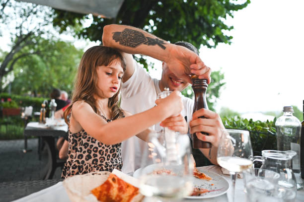 istock Family eating at restaurant. 2190566926