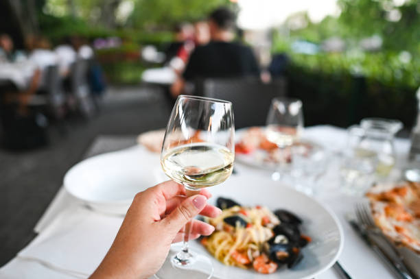 istock Woman at restaurant with wine glass. 2190566946