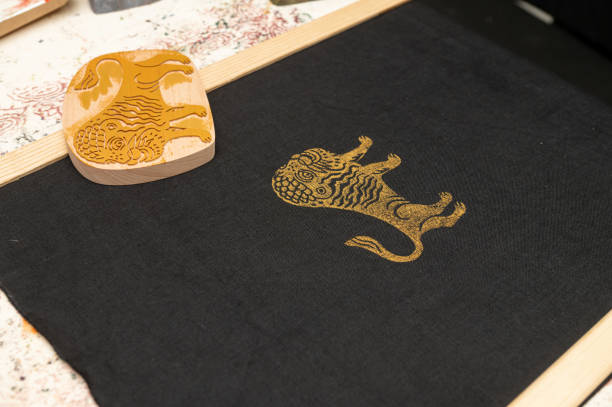 Traditional block printing on fabric with ornate lion design