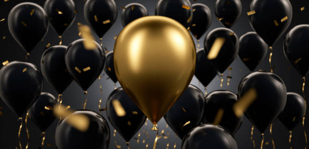 istock Group of floating golden and black balloons 2190570098