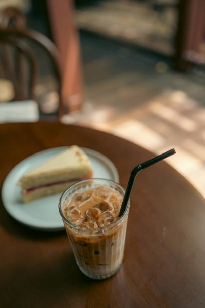 istock Ice coffee and blueberry cheese cake on wood table 2190570425