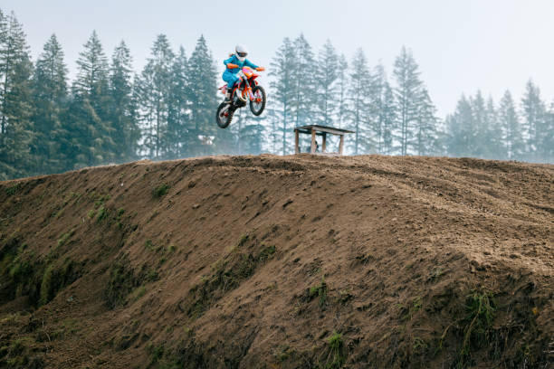 A shot of a motocross rider in midair during a race
