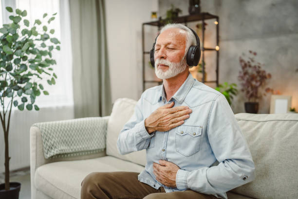 istock senior male eyes closed have guided training yoga or meditation 2190572329