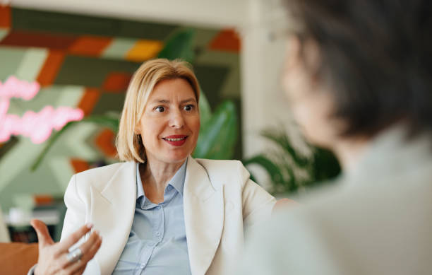 istock Businesswoman Engaged in Discussion in a Modern Office Setting 2190572378