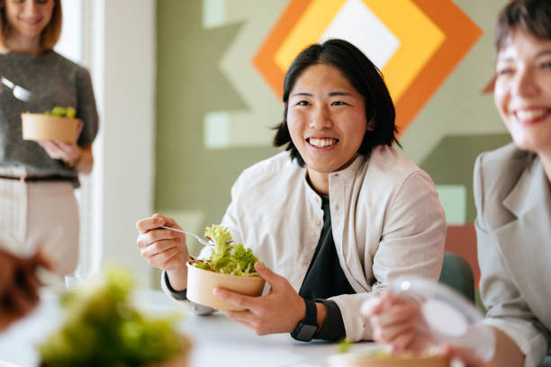 Business Team Enjoying a Healthy Lunch in a Creative Co-Working Space