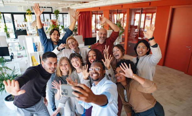 istock Diverse Team Posing for an Enthusiastic Group Selfie in Modern Office 2190572426