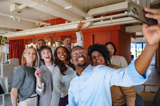 istock Group of Professionals Taking a Selfie in a Modern Workspace 2190572428