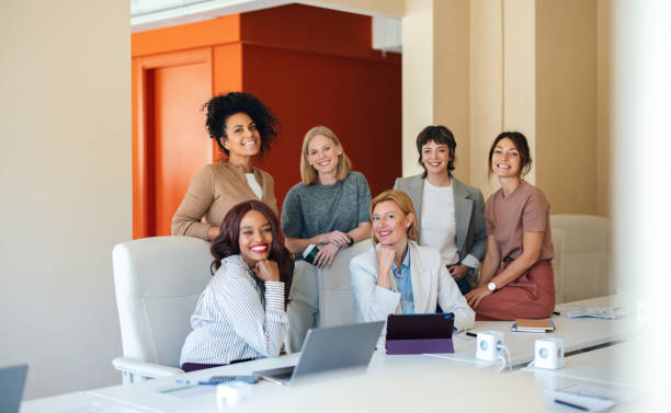 istock Group of Professional Women Collaborating in a Modern Office Setting 2190572432