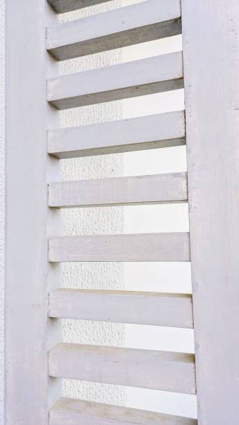 istock white wooden shutter. jalousie 2190573254