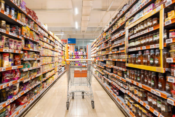istock Empty cart in supermarket aisle 2190574556