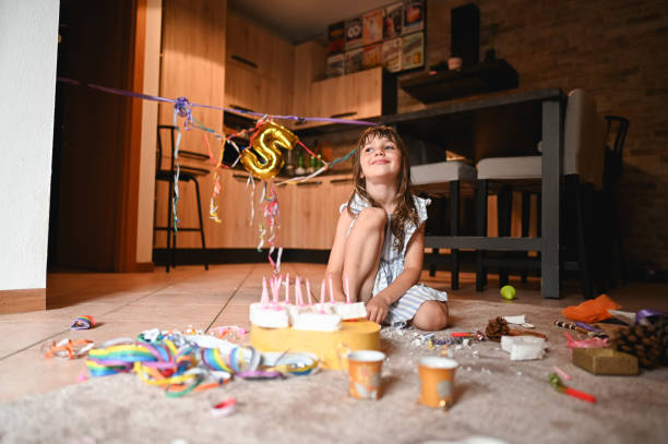 istock Child having birthday tea party in kitchen. 2190575052