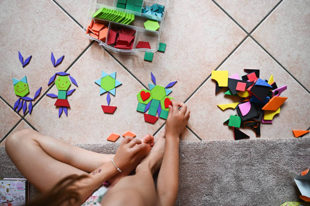 istock playing with a wooden puzzle 2190576116