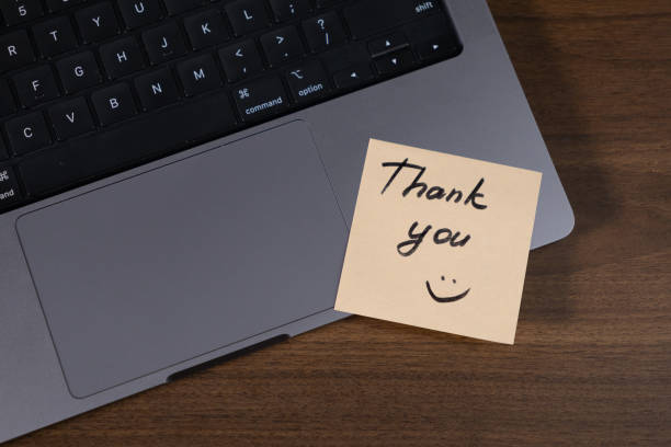 istock thank you note on laptop touchpad with smiley face for appreciation and workplace positivity 2190578361