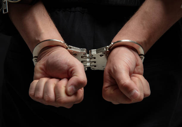 istock Hands in handcuffs. Crime arrest and jail concept 2190582585