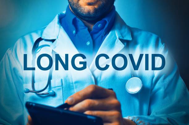 istock Doctor in uniform while writing a prescription for Long Covid 2190583886