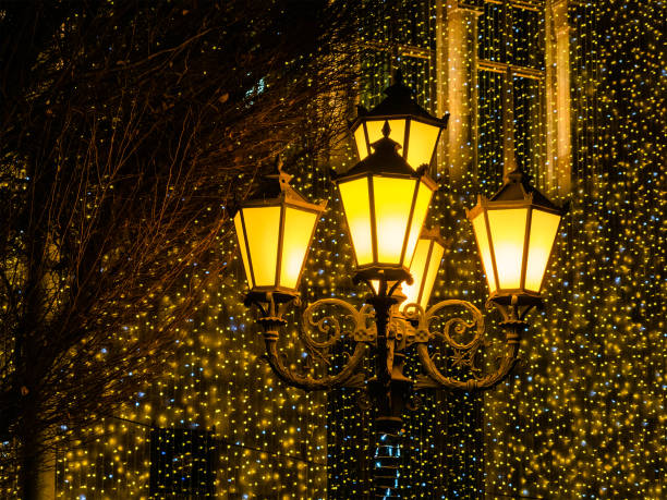 Christmas lights - urban lantern and garlands in background in Yerevan city in winter evening