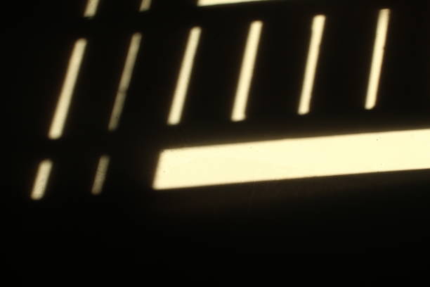 istock shadow on the wall. sunlight coming in through the window creates a shadow on the wall. 2190588732