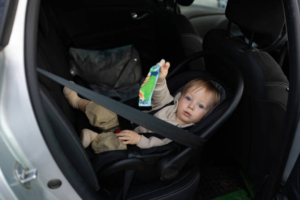 istock Baby Boy Enjoys a Snack While Safely Buckled 2190590631