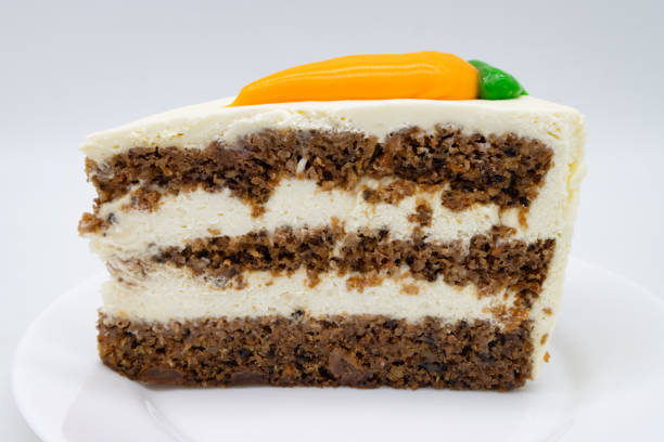 istock Slice of Delicious Carrot Cake with Layers on a White Plate 2190592632