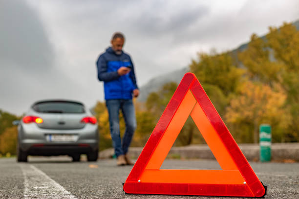 istock Car breakdown on an autumn foggy road. 2190593441