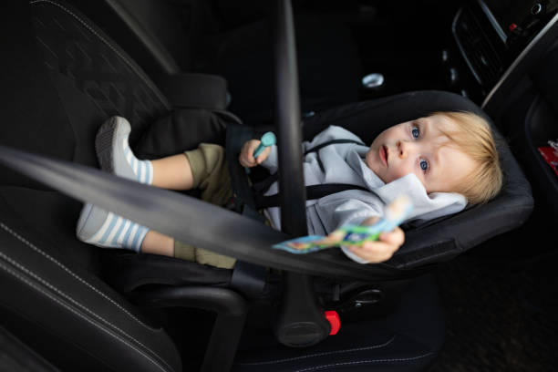 istock Baby Boy in Car Seat Enjoying a Snack 2190593911