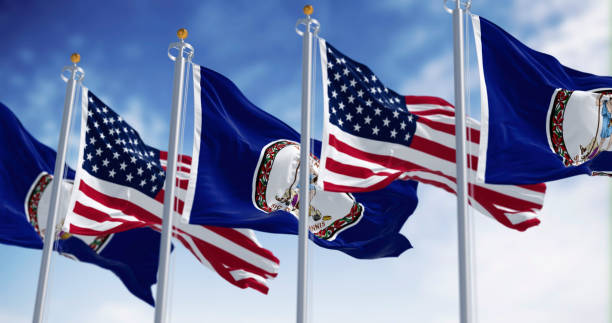 istock Virginia and the US flags waving in the wind on a clear day 2190600580
