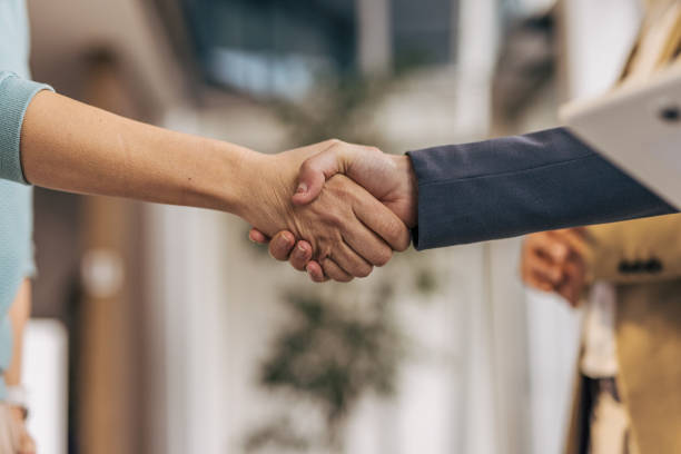 istock Close-up of two shaking hands. 2190600829