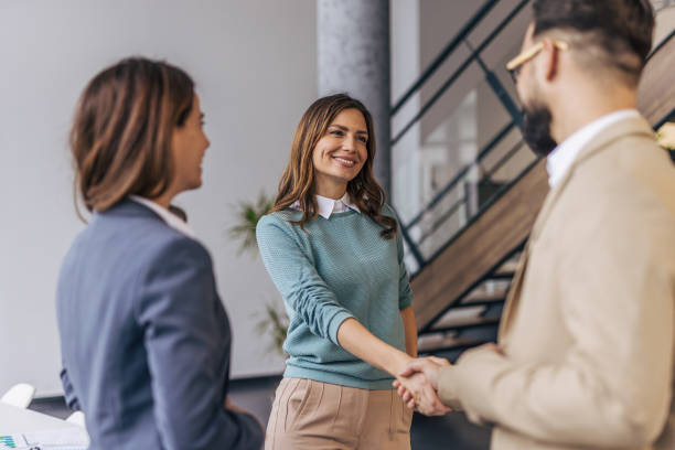 istock Businesspeople making a deal. 2190602328