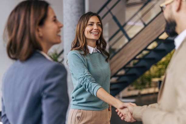 istock Businesspeople making a deal. 2190602382