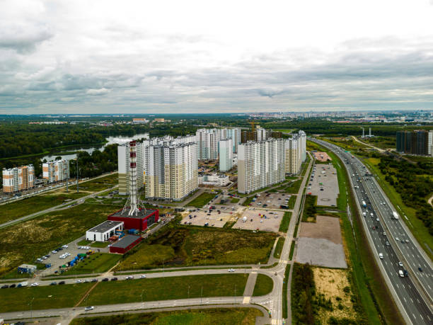 istock Urban Development Landscape featuring a busy Highway and various Residential Buildings 2190602878