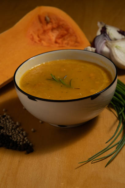 istock Bowl of pumpkin soup with ingredients around it. 2190603512