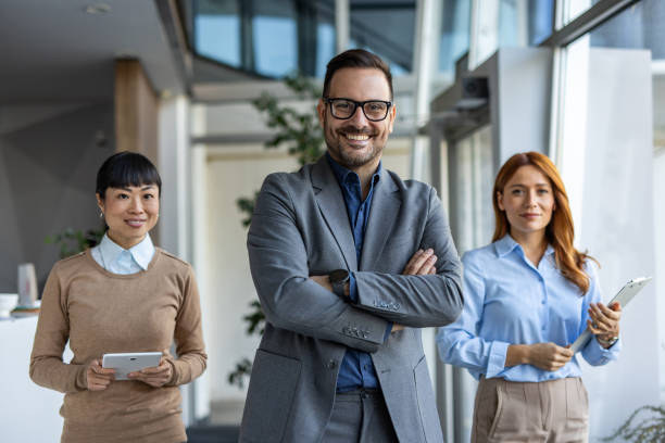 istock Corporate strategy session - Multiracial team with crossed-armed leader 2190605323