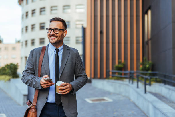 istock Confident Businessman Enjoying a Coffee Break Outdoors 2190606580